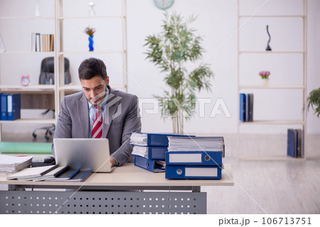 Young male employee working in the office 106713751