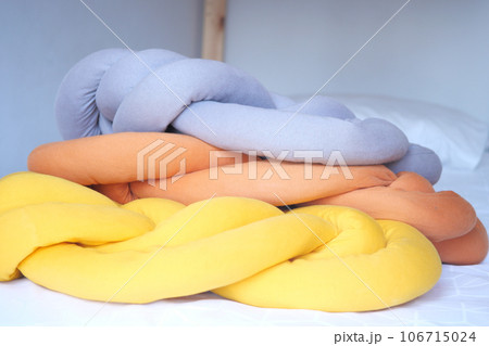 colorful pillow on white bed colorful pillow on white bed 106715024
