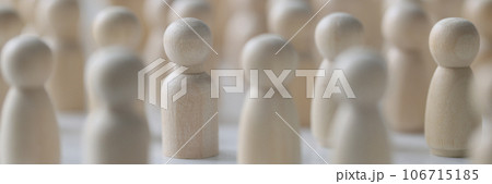 Many wooden figures standing close to each other, shallow depth of field. 106715185