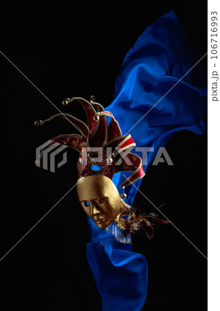Old carnival masks with flutters blue cloth. 106716993