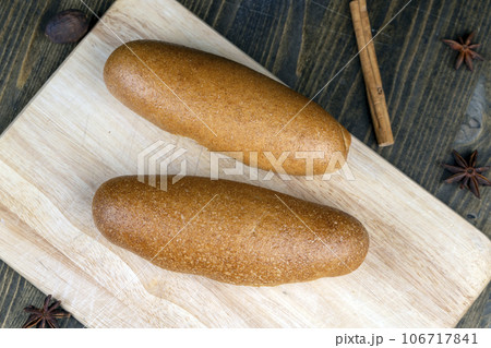 fresh wheat bread with bran on the cutting board fresh wheat bread with bran on the cutting board 106717841