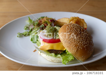 A hamburger on a white plate 106718101