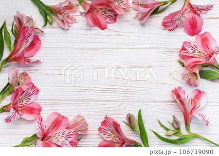 Beautiful Alstroemeria flowers on wooden background 106719090