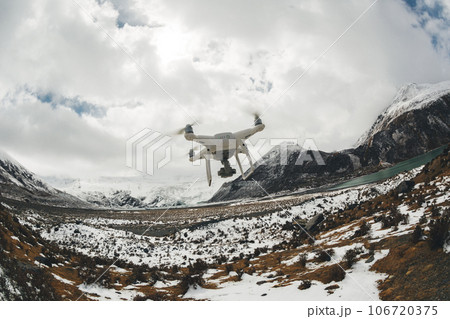 Flying drone taking picture of landscape in Tibet, China 106720375