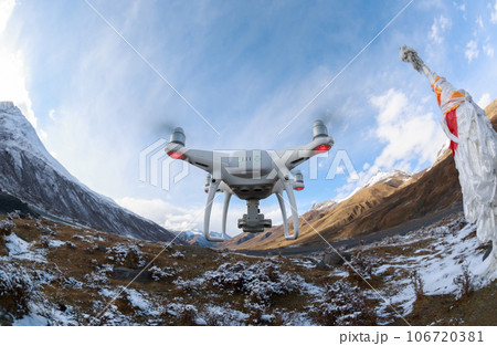 Flying drone taking picture of landscape in Tibet, China 106720381