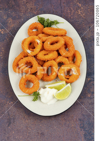 Fried squid rings breaded. Fried squid rings breaded. 106720865