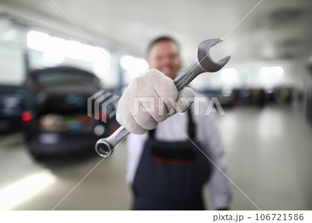 Mechanic with metal wrench Mechanic with metal wrench 106721586