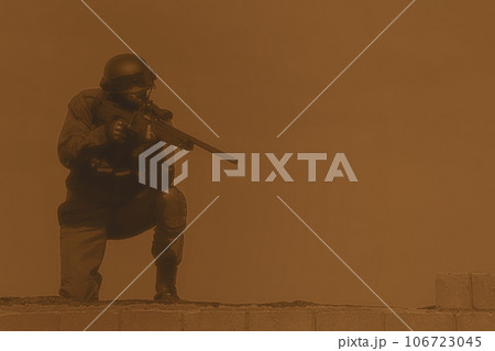 SWAT police sniper in black uniform in action on the roof top 106723045