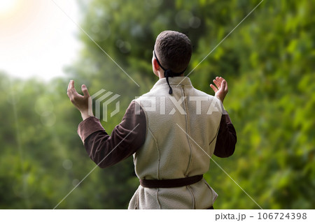Praying man with raised hands Praying man with raised hands 106724398