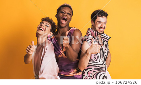 Three trans men gesturing to be fine with the thumb up on yellow 106724526