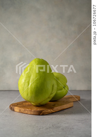 Chayote exotic fruits (Sechium edulis) on grey background. Chayote exotic fruits (Sechium edulis) on grey background. 106726677