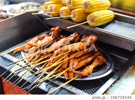 Grilled chicken wings bbq in Jalan Alor street food in Kuala Lumpur Grilled chicken wings bbq in Jalan Alor street food in Kuala Lumpur 106729348