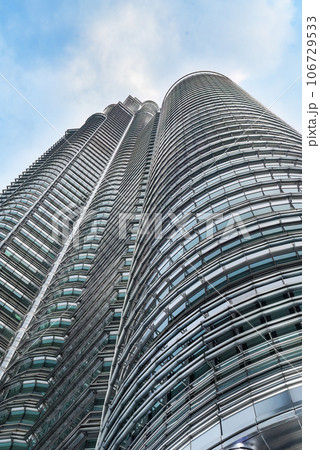 Kuala Lumpur, Malaysia - 26 August 2023: Petronas twins tower from close up point of view 106729533