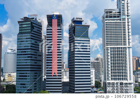 Kuala Lumpur, Malaysia - 26 August 2023: National Malaysian flag on building for a Merdeka day Kuala Lumpur, Malaysia - 26 August 2023: National Malaysian flag on building for a Merdeka day 106729558