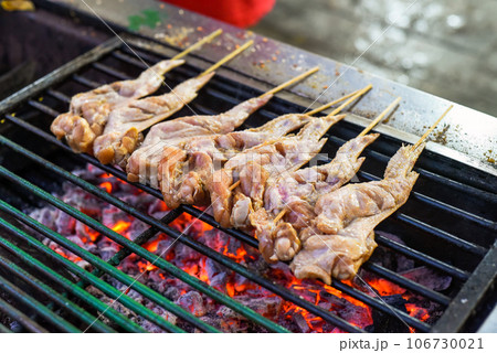 Raw chicken wings for bbq on grill in Jalan Alor street food in Kuala Lumpur 106730021