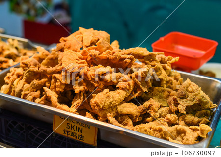 Fried chicken skin in the street food Jalan Alor in Kuala Lumpur 106730097