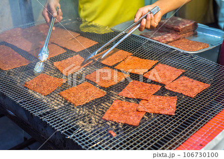 Bbq slice meat pork in the street food Jalan Alor in Kuala Lumpur 106730100