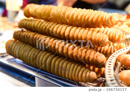 Twisted potatoes in the night market of street food Jalan Alor in Malaysia Twisted potatoes in the night market of street food Jalan Alor in Malaysia 106730157