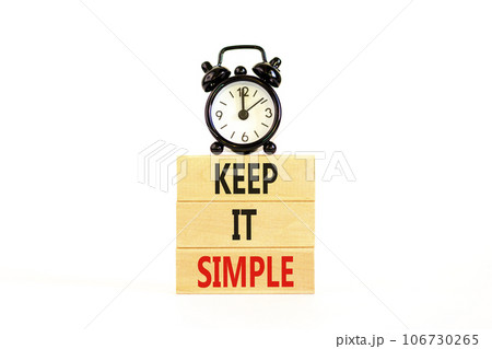 Keep it simple symbol. Concept word Keep it simple on beautiful wooden block. Black alarm clock. Beautiful white table white background. Business motivational keep it simple concept. Copy space. Keep it simple symbol. Concept word Keep it simple on beautiful wooden block. Black alarm clock. Beautiful white table white background. Business motivational keep it simple concept. Copy space. 106730265