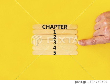 Time to chapter 3 symbol. Concept word Chapter 1 2 3 4 5 on wooden sticks. Businessman hand. Beautiful yellow table yellow background. Business planning and time to chapter 3 concept. Copy space. 106730309