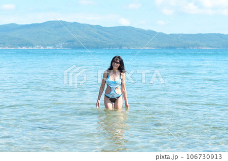 Happy 45 years old Russian woman swimming Japanese sea Happy 45 years old Russian woman swimming Japanese sea 106730913