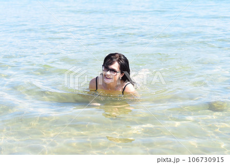 Happy 45 years old Russian woman swimming Japanese sea 106730915
