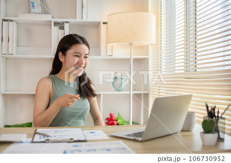 Young woman Working from Home, Video Call with Customer in Office, Remote Business Communication, Telecommuting Professional, Virtual Video Call with Office Customer, Work from Home Concept. 106730952