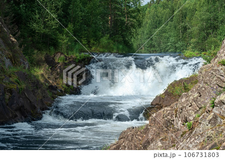 natural landscape with a clear waterfall on a forest river 106731803