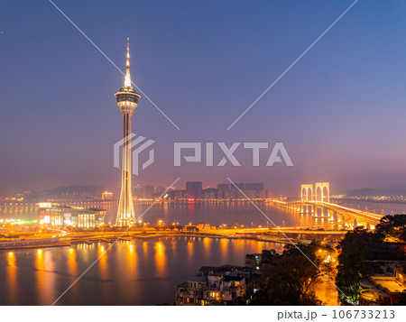 Sunset high angle view of the Macau Tower Convention and Entertainment Center and cityscape 106733213