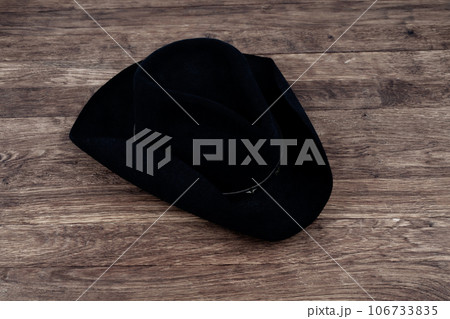 Old west hat on table. Top view. 106733835