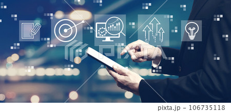 Marketing Strategy concept with businessman using a tablet Marketing Strategy concept with businessman using a tablet 106735118