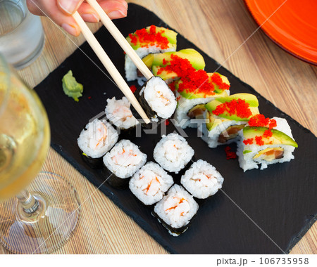 Set of different types of sushi served on board 106735958