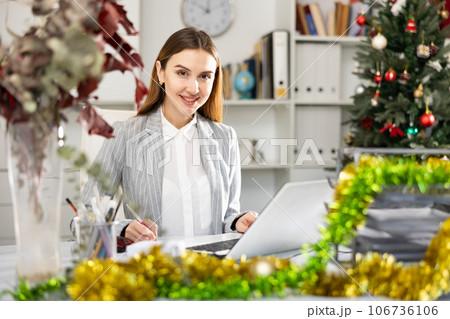 Portrait of female office worker during Christmastime 106736106