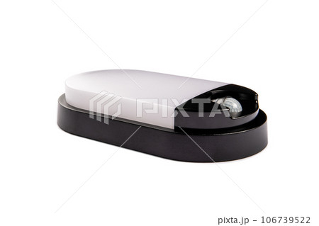 Lamp with a motion sensor on a white background. Close up Lamp with a motion sensor on a white background. Close up 106739522