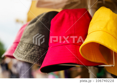 Multi-colored Panama hats on the counter of a trade tent at a fair. Selective sharpening, texture. Small business. 106740228