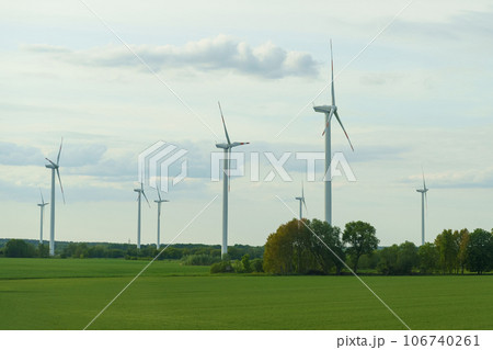 Landscape from renewable energy wind turbine with field, forest and sky. Landscape from renewable energy wind turbine with field, forest and sky. 106740261