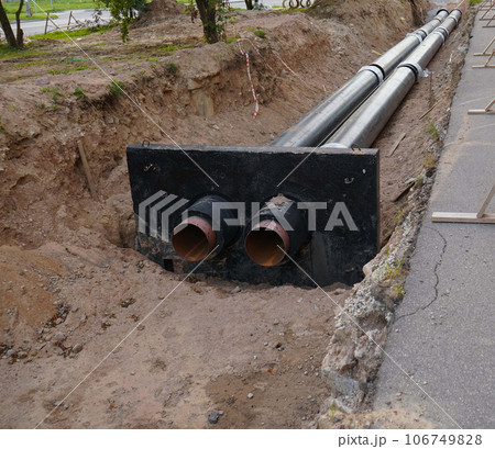Installation of the distribution unit of heating and water supply network. Frame for connecting pipes in the trench of ground Installation of the distribution unit of heating and water supply network. Frame for connecting pipes in the trench of ground 106749828