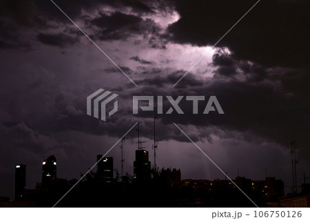 Ray. Storm. The sky is full of dark clouds in bad weather before a big storm rain. Light emission from the Edge of clouds. Zoom the surface of a Black haze at close range. 106750126