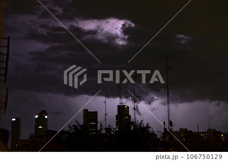 Ray. Storm. The sky is full of dark clouds in bad weather before a big storm rain. Light emission from the Edge of clouds. Zoom the surface of a Black haze at close range. Ray. Storm. The sky is full of dark clouds in bad weather before a big storm rain. Light emission from the Edge of clouds. Zoom the surface of a Black haze at close range. 106750129