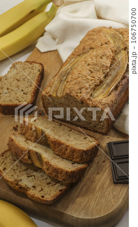 fresh banana bread lies on a gray background close-up 106750700