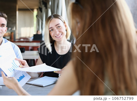 A group of people attending a seminar 106752799