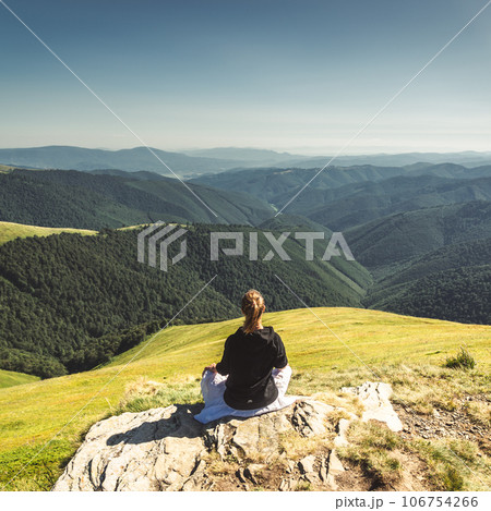 Young woman on the top of mountain Young woman on the top of mountain 106754266