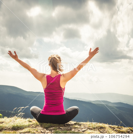 Young woman on the top of mountain 106754294