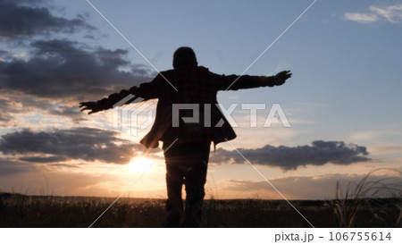 American boy runs across field with his hands up, childhood dream airplane pilot, happy child run sunset, child boy superhero, child dreams flying, wants become astronaut, become airplane pilot 106755614