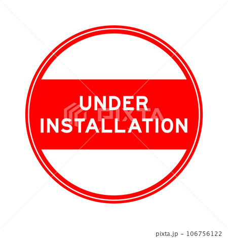 Red color round seal sticker in word under installation on white background 106756122