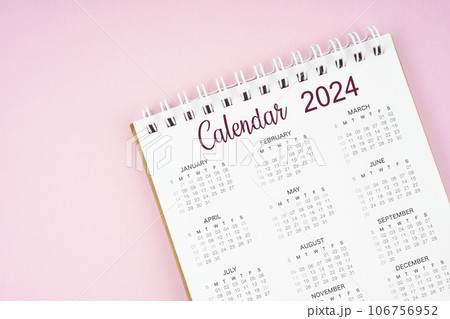 12 months desk calendar 2024 on pink color background. 106756952