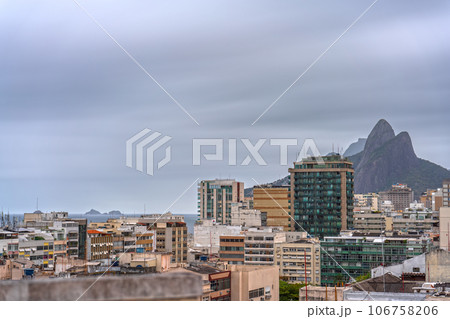 Stormy Sky over Rio de Janeiro Cityscape with Two Brothers Rocks Stormy Sky over Rio de Janeiro Cityscape with Two Brothers Rocks 106758206