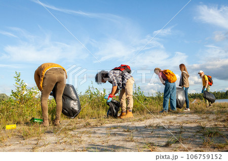Diverse Friends Cleaning the Lake Shore Diverse Friends Cleaning the Lake Shore 106759152