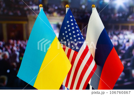 The US flag, Russian flag, Ukraine flag. Flag of USA, flag of Russia, flag of Ukraine. The United States of America and the Russian Federation confrontation. Russia's invasion of Ukraine The US flag, Russian flag, Ukraine flag. Flag of USA, flag of Russia, flag of Ukraine. The United States of America and the Russian Federation confrontation. Russia's invasion of Ukraine 106760867