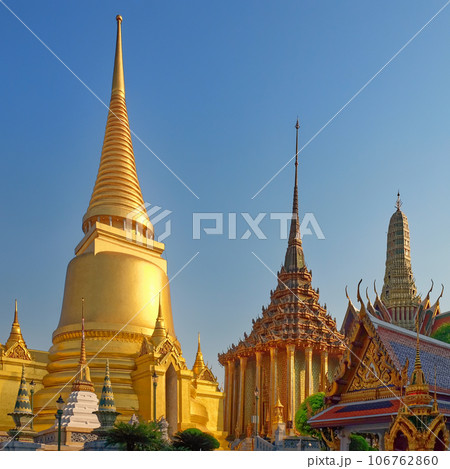 Beautiful temple located in Thailand. The temple complex is made up of multiple buildings, each boasting ornate roofs and walls. 106762860